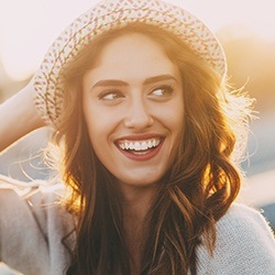Owings Mills Cosmetic Dentist Smiling woman with sun hat