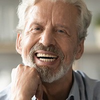 Man with dentures smiling