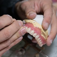 Lab tech making dentures