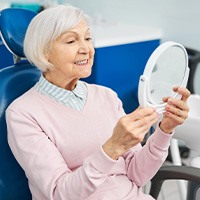 Senior woman smiling in the dental chair