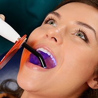 Woman receiving a tooth-colored filling