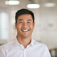 Young male professional smiling at work